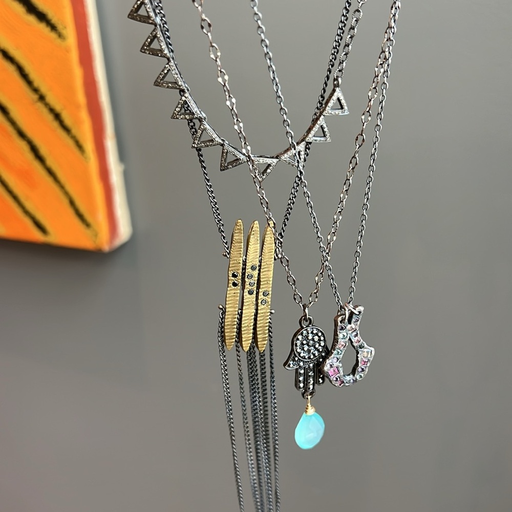 2 remaining from the silver. The diamond triangle choker and the Geoffrey Young.